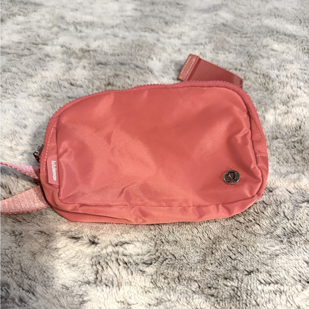 Brand New Lululemon one liter beltbag.  Medium Pink Color.